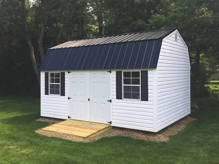 lofted garden shed with shingled roof
